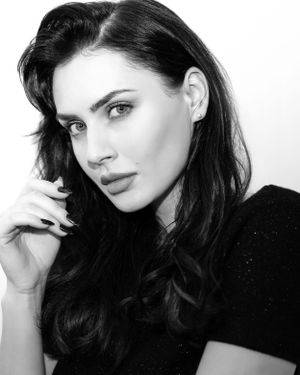 a photo by a professional photographer of a professional model during a model or fashion photo session in lingerie