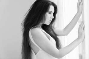 a photo by a professional photographer of a professional model during a model or fashion photo session in lingerie