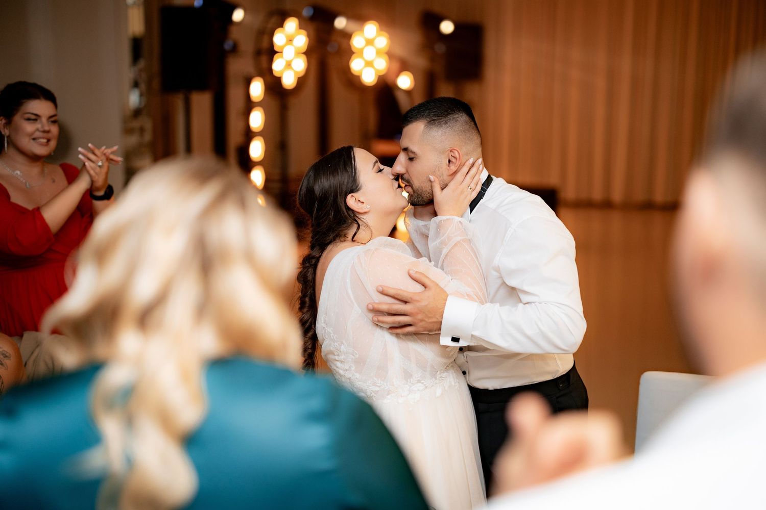 Romantic moment captured during a wedding reception dance.
