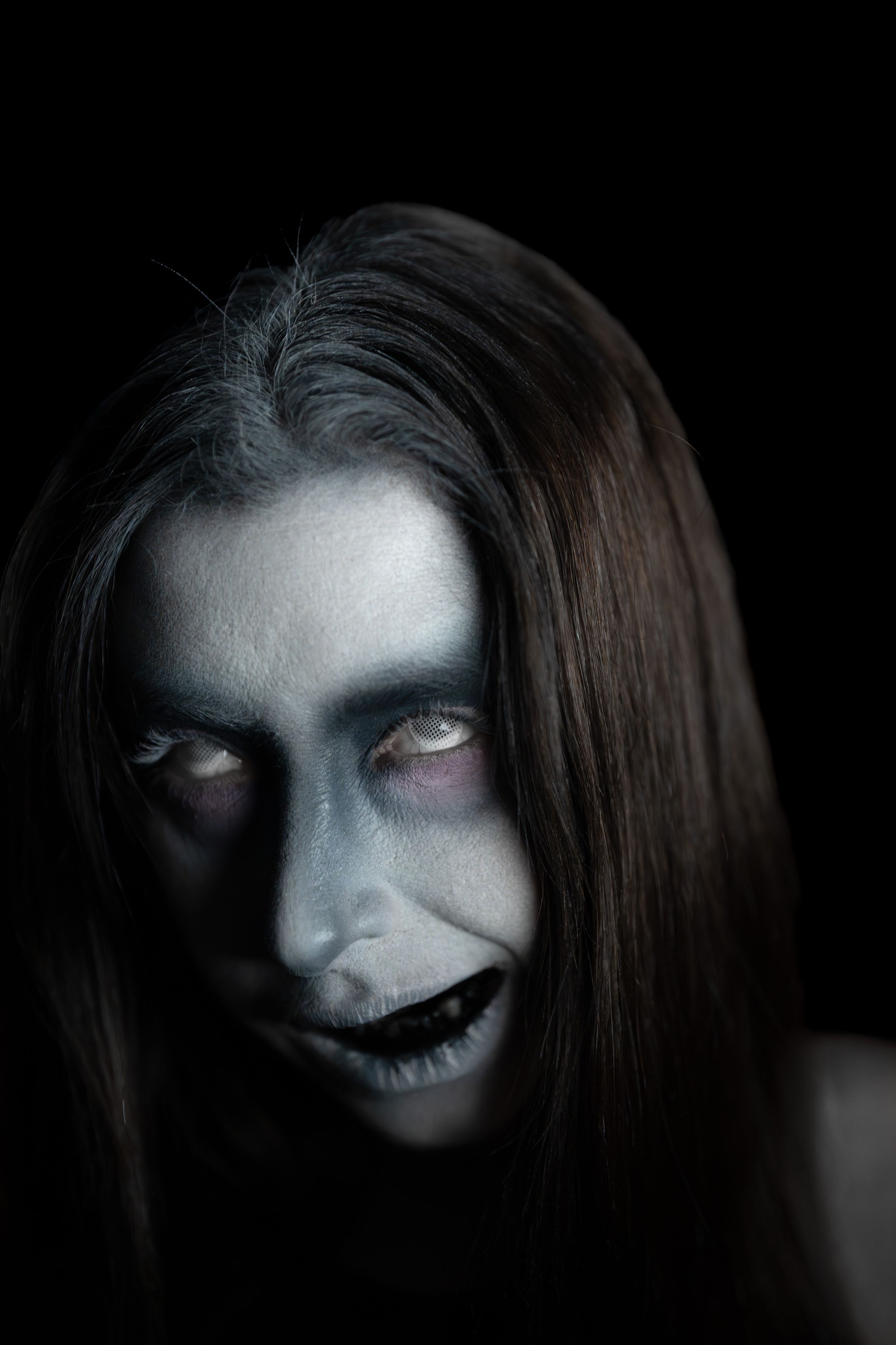 Creepy ghost with black liquid coming out of its mouth.