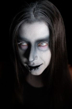 Creepy ghost with black liquid coming out of its mouth.