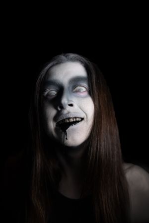 Creepy ghost with black liquid coming out of its mouth.