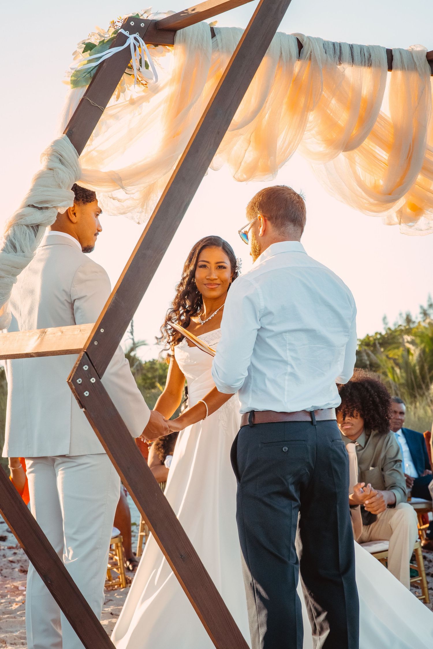 Coastal wedding photography with bride and groom on the beach in Fort Pierce, Florida.