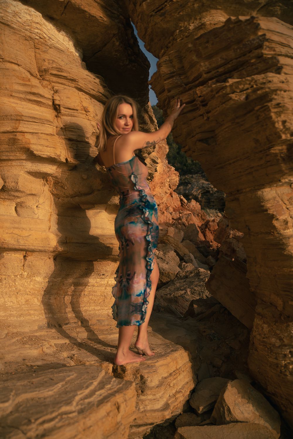 Rock climbing sequence on natural sandstone formation in warm evening light.