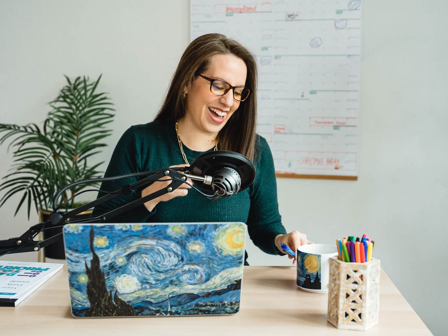 productivity coach laughing sitting on floor with confetti