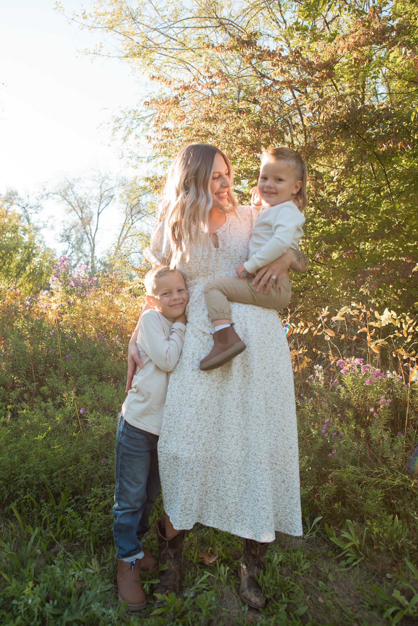A family outside smiling in the sunshine in Boise Idaho