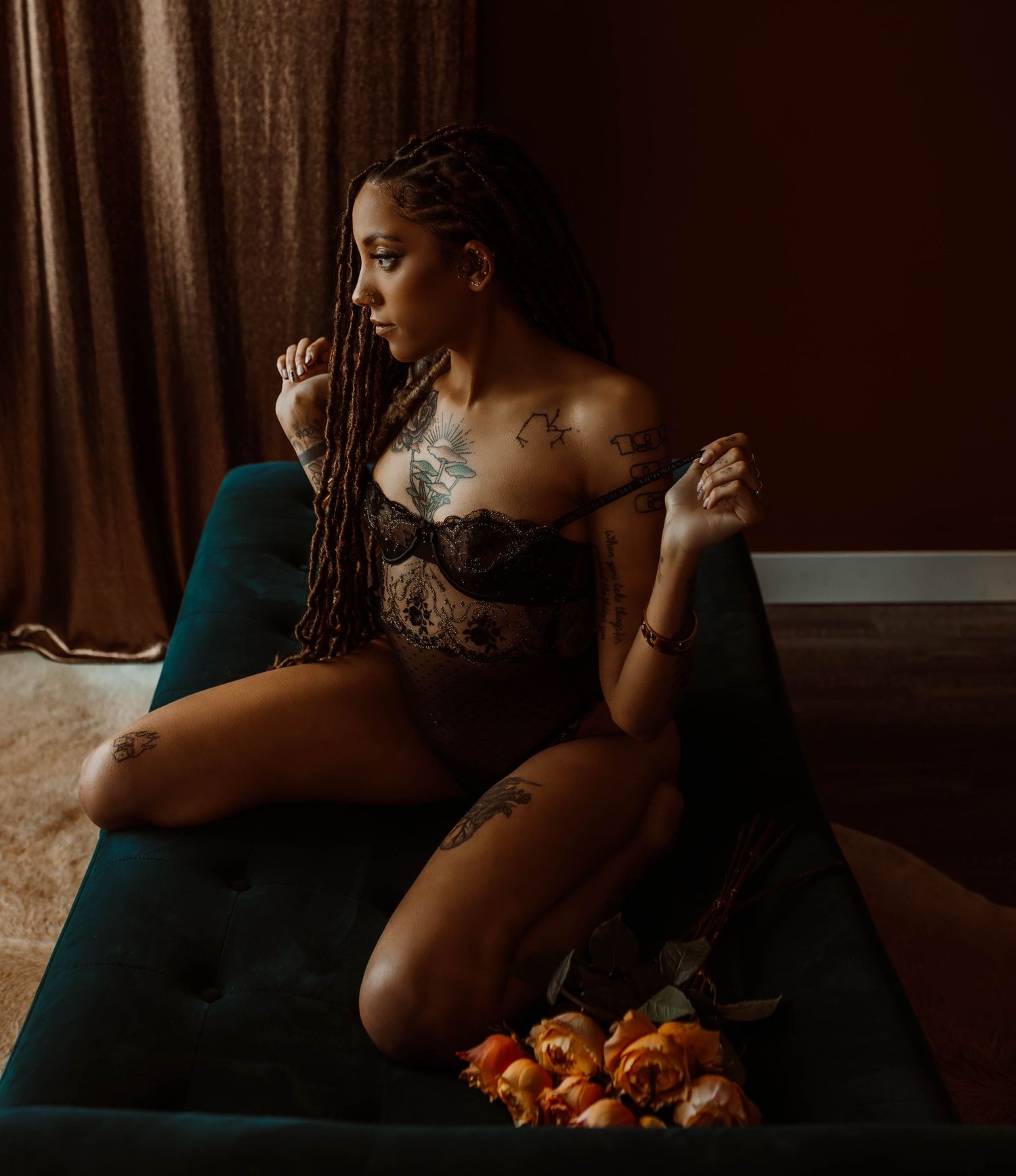 Stillwater Minnesota boudoir photographer, Boudoir by KJ, photographing a woman with flowers.
