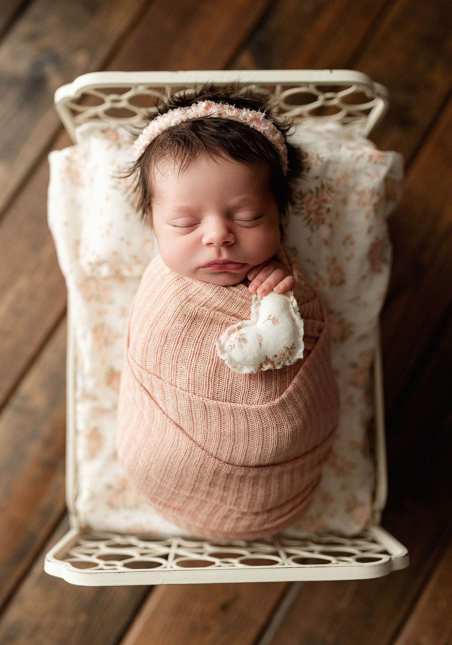 A newborn girl on a bed. Greenville, SC newborn photographer, Easley, SC newborn photographer, Upstate, SC newborn photographer.