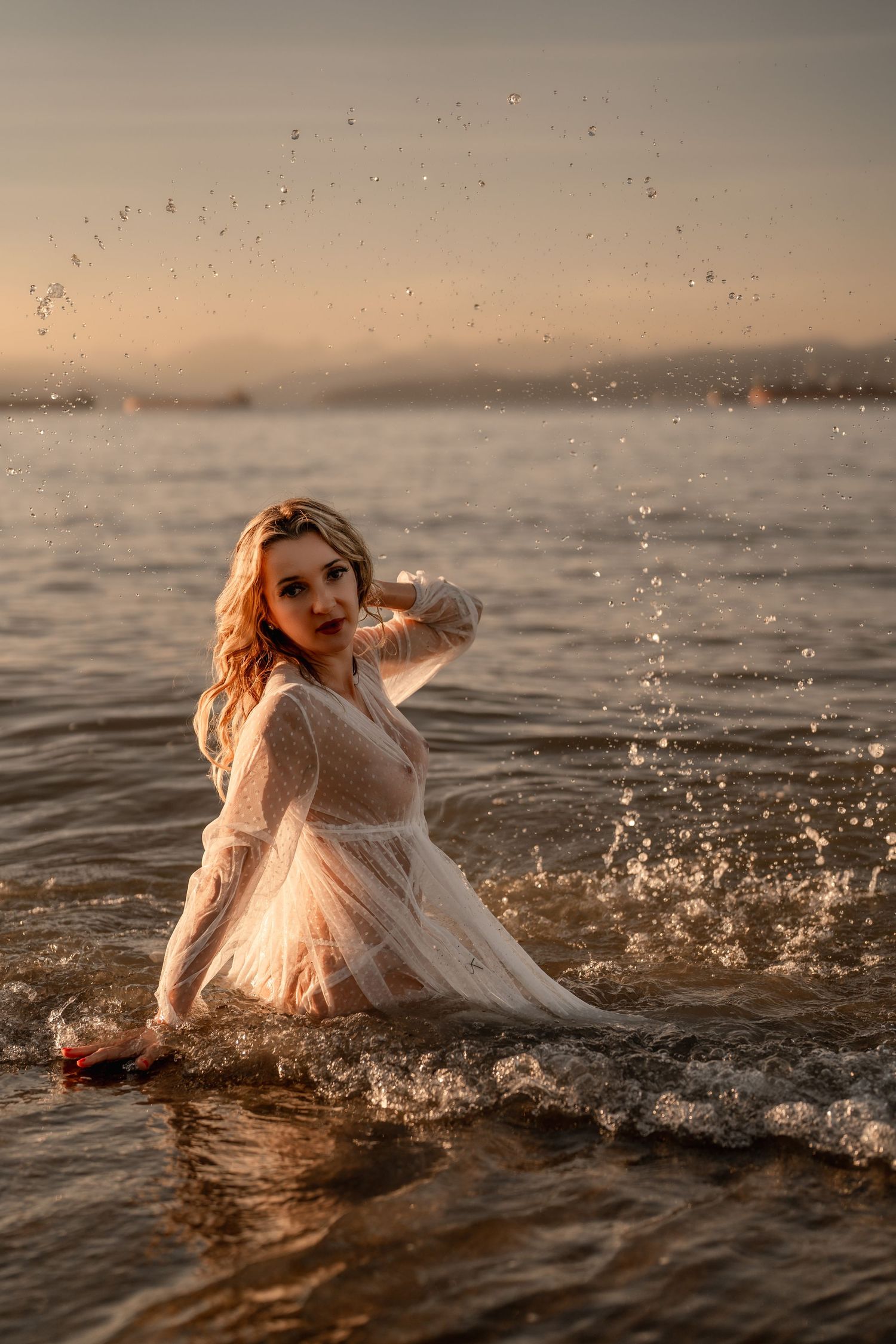 Elegant boudoir session Vancouver woman posing in the ocean