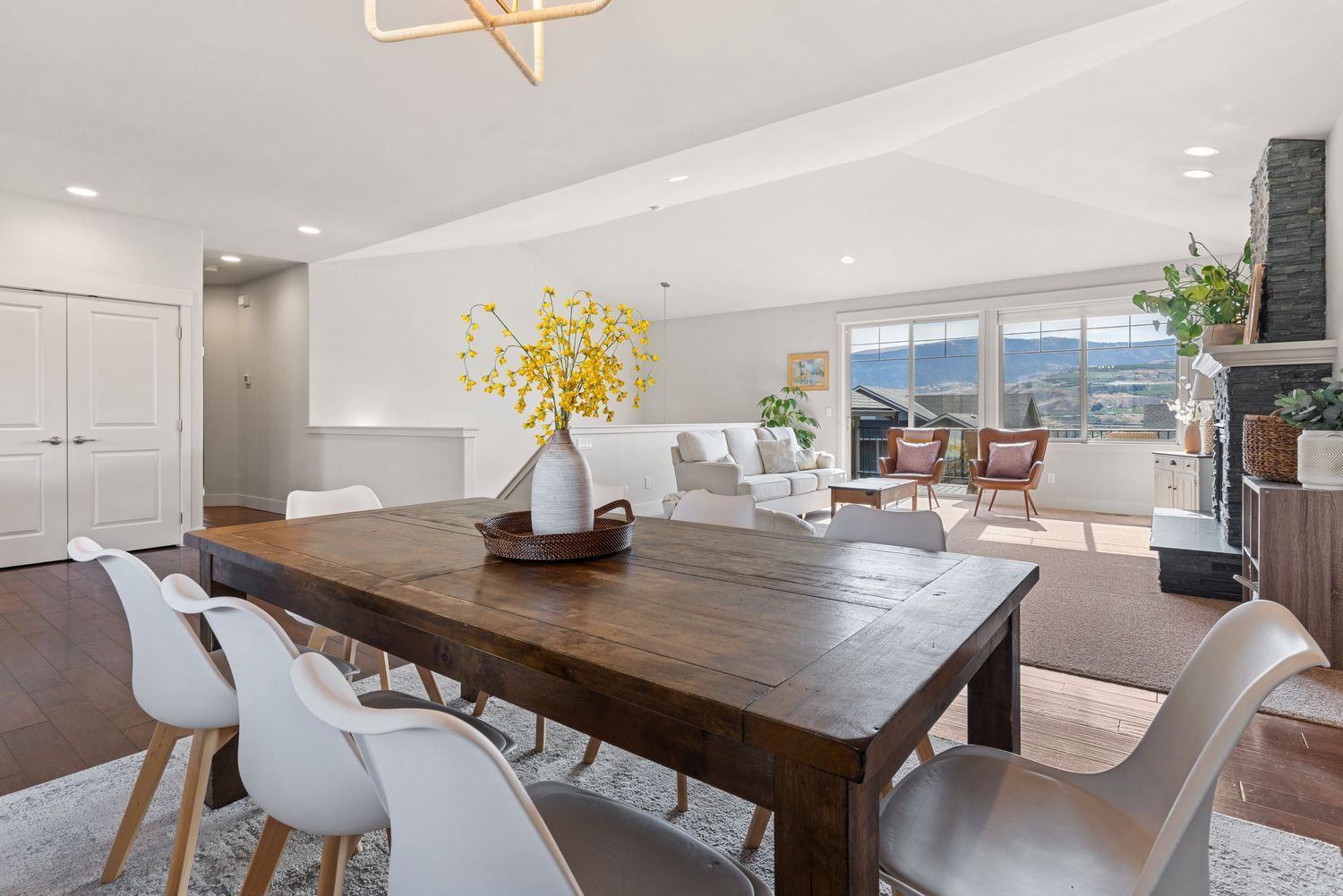 Modern dining area with natural light and open-concept layout in professionally photographed home in Wenatchee, WA.