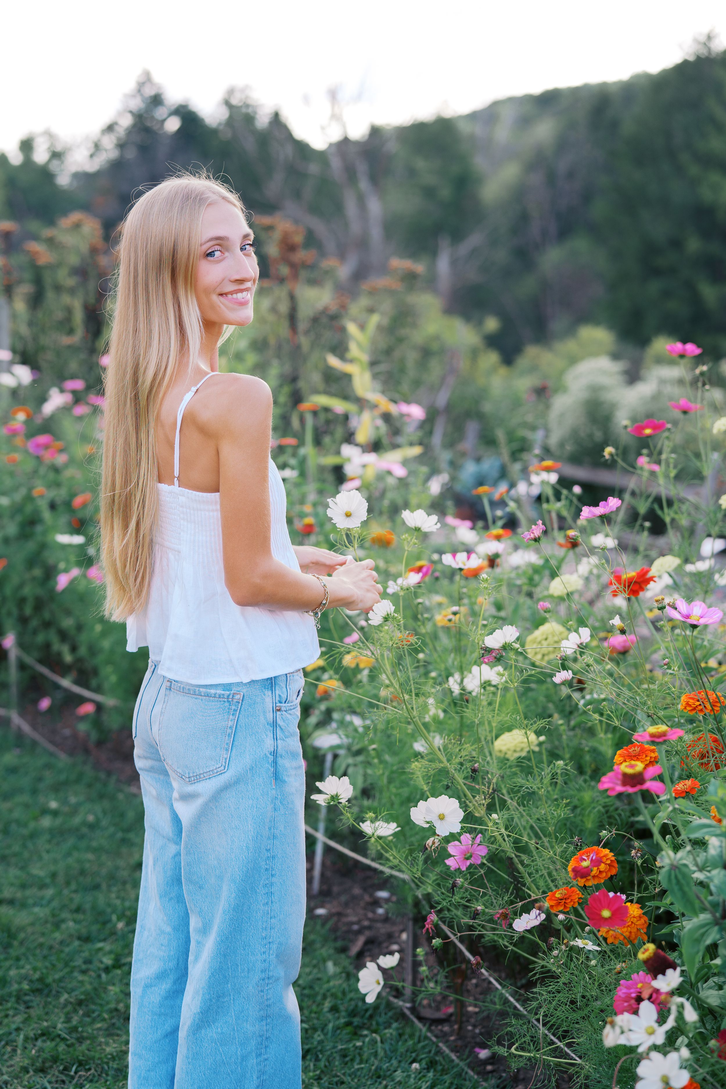 A casual outdoor photoshoot among vibrant wildflowers with light and airy styling.