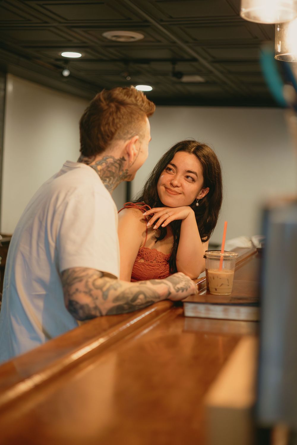 Cozy coffee shop engagement photos in downtown Parker, Colorado.