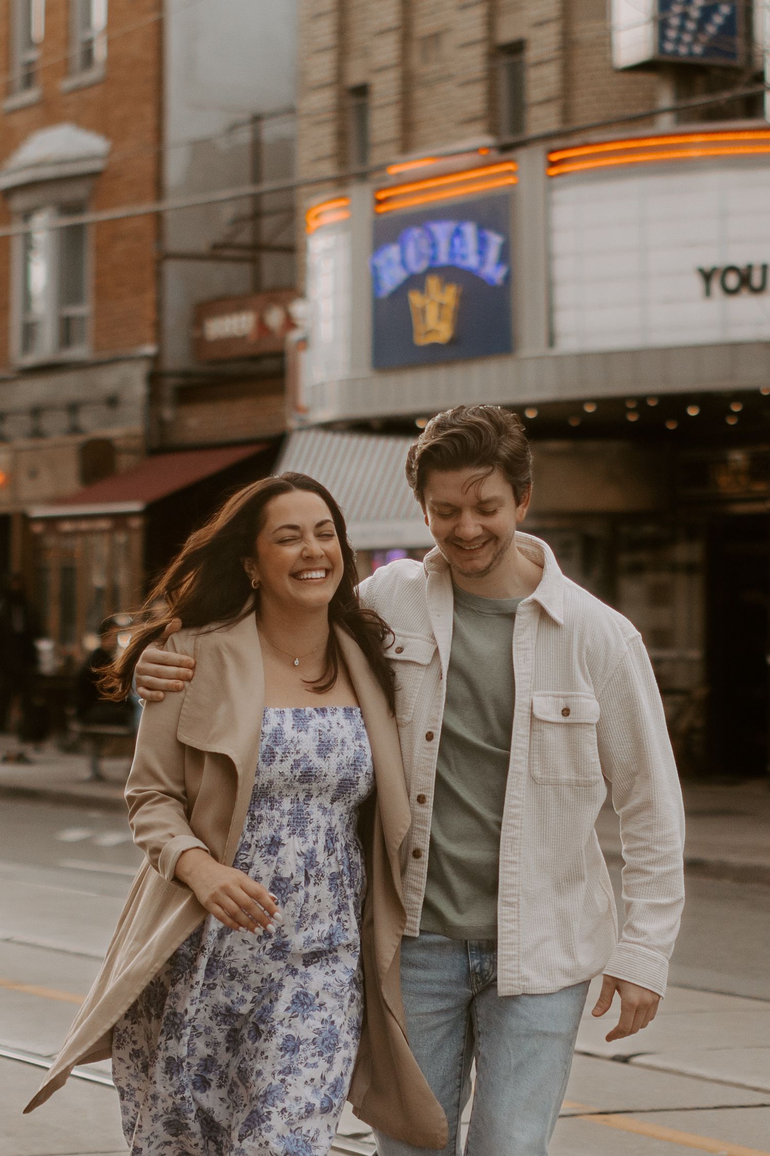 A candid city engagement session photography on College West St in Toronto