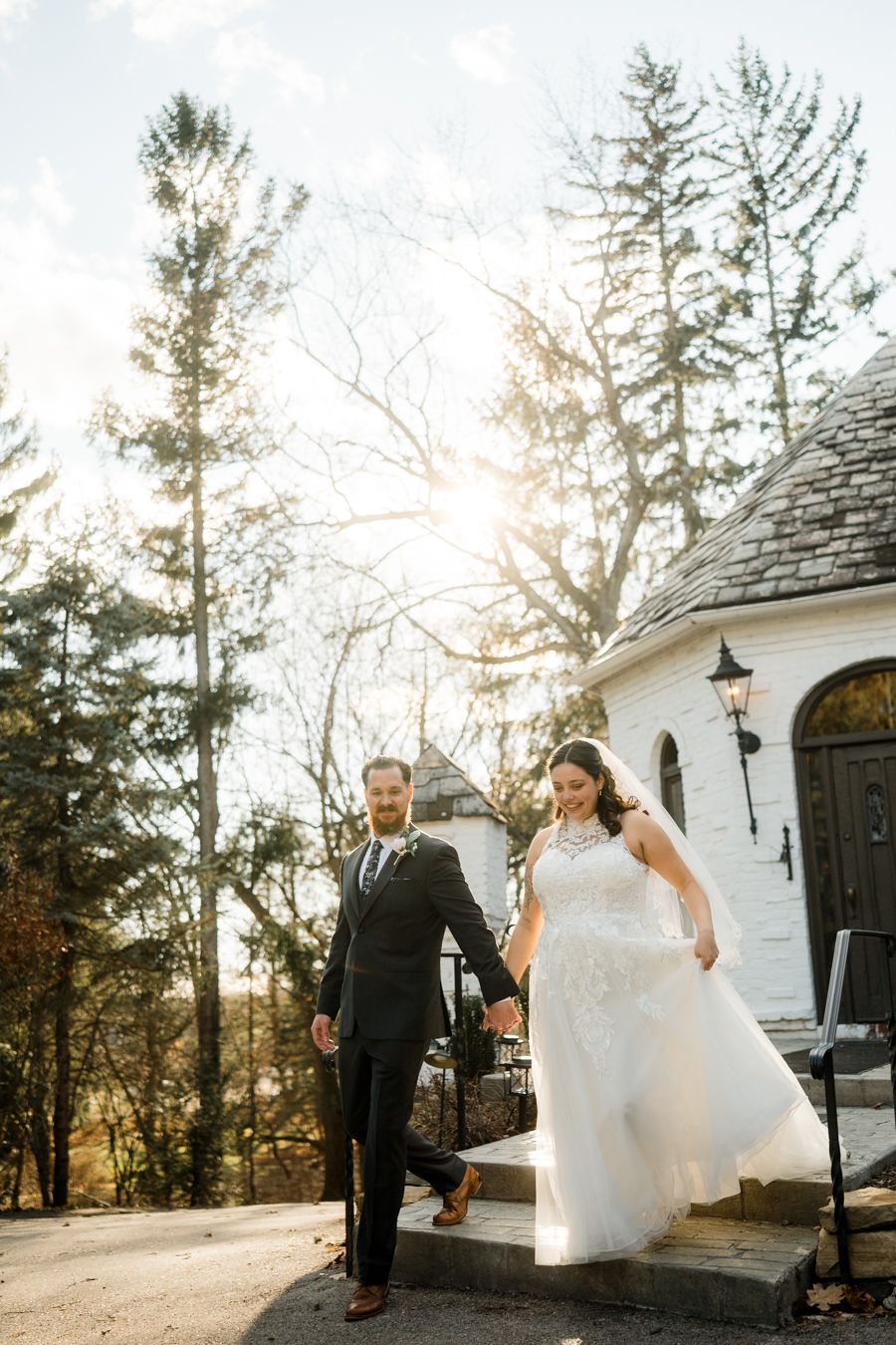 Newlyweds walking outside in golden light, documentary wedding film photography at the Hyeholde Restaurant and pub