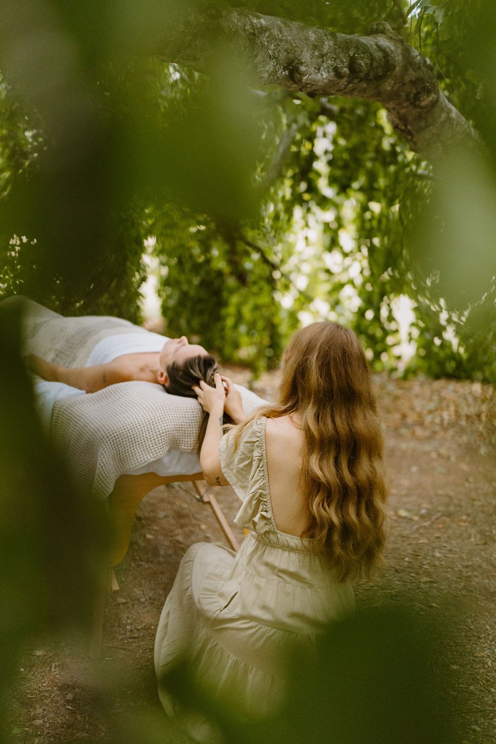 Ethereal portrait sequence showing movement through blurred foliage with soft natural lighting and dreamy atmosphere.