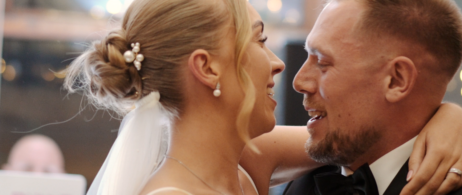 Intimate wedding moment captured during outdoor autumn celebration.