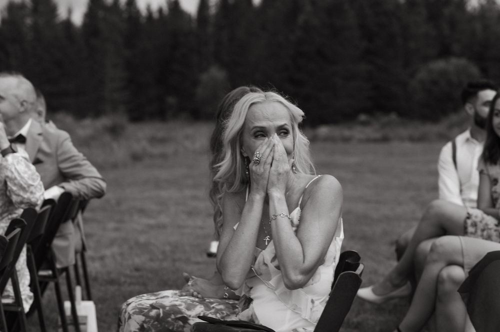 A series of black and white photos showing tender moments between people and horses in a pastoral setting.