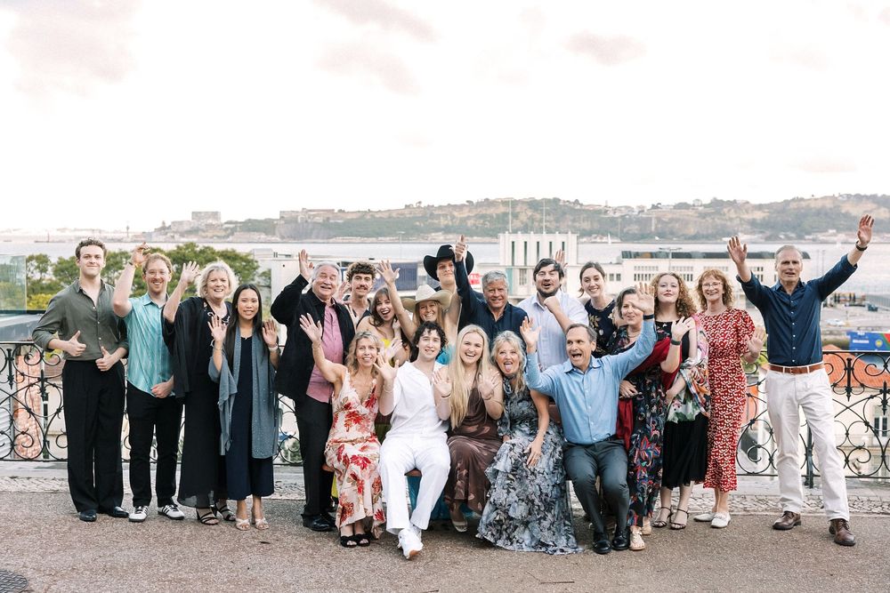 Relaxed group photo during a destination wedding rehearsal dinner in Lisbon, Portugal