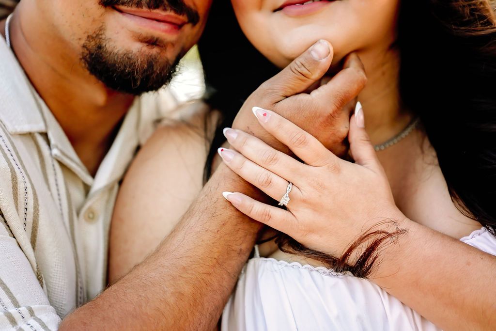 Both fiance holding each others face during engagement session