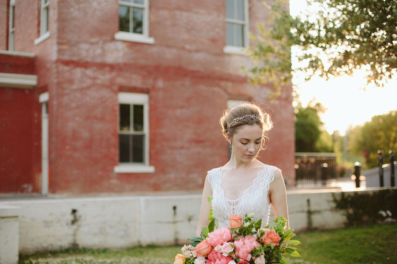 Bride and groom exchanging vows at elegant wedding ceremony with guests seated in background.