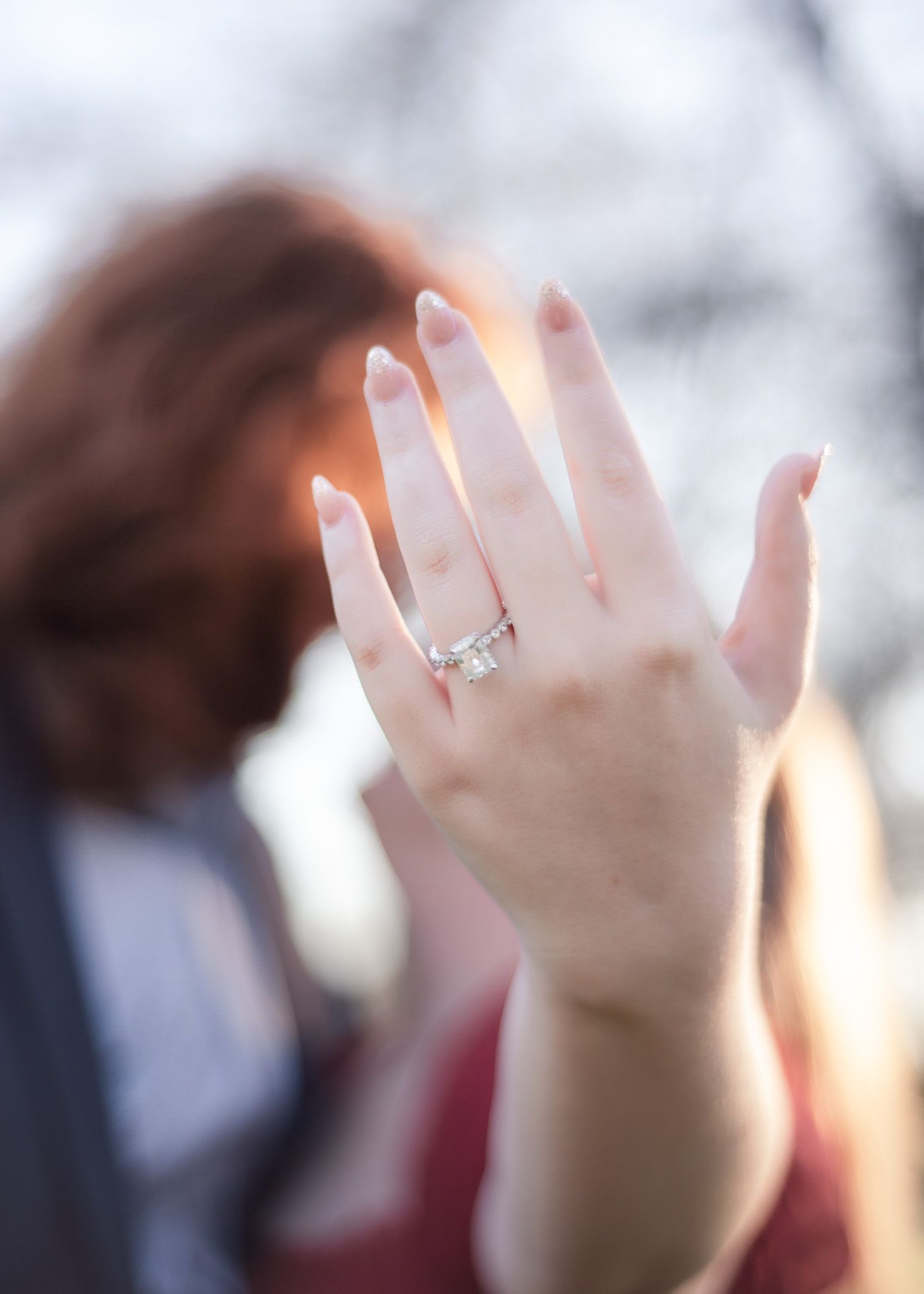 Close-up of engagement ring during proposal photoshoot in Temple Texas at Pepper Creek Trail with soft golden light