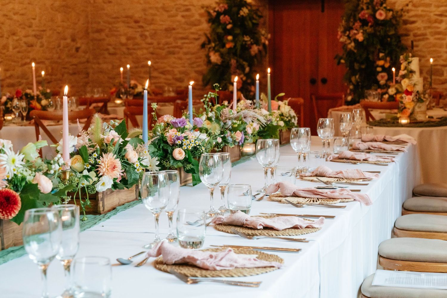 Kingscote Barn Wedding Photography near Stroud in Gloucestershire Top table decor