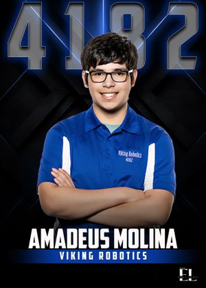 Amadeus Molina poses with crossed arms in blue Viking Robotics team shirt, number 4182.