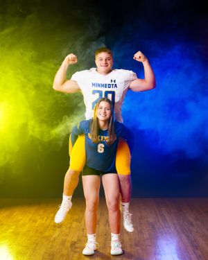 Minneota Vikings football and volleyball athletes posing together in blue and gold uniforms.