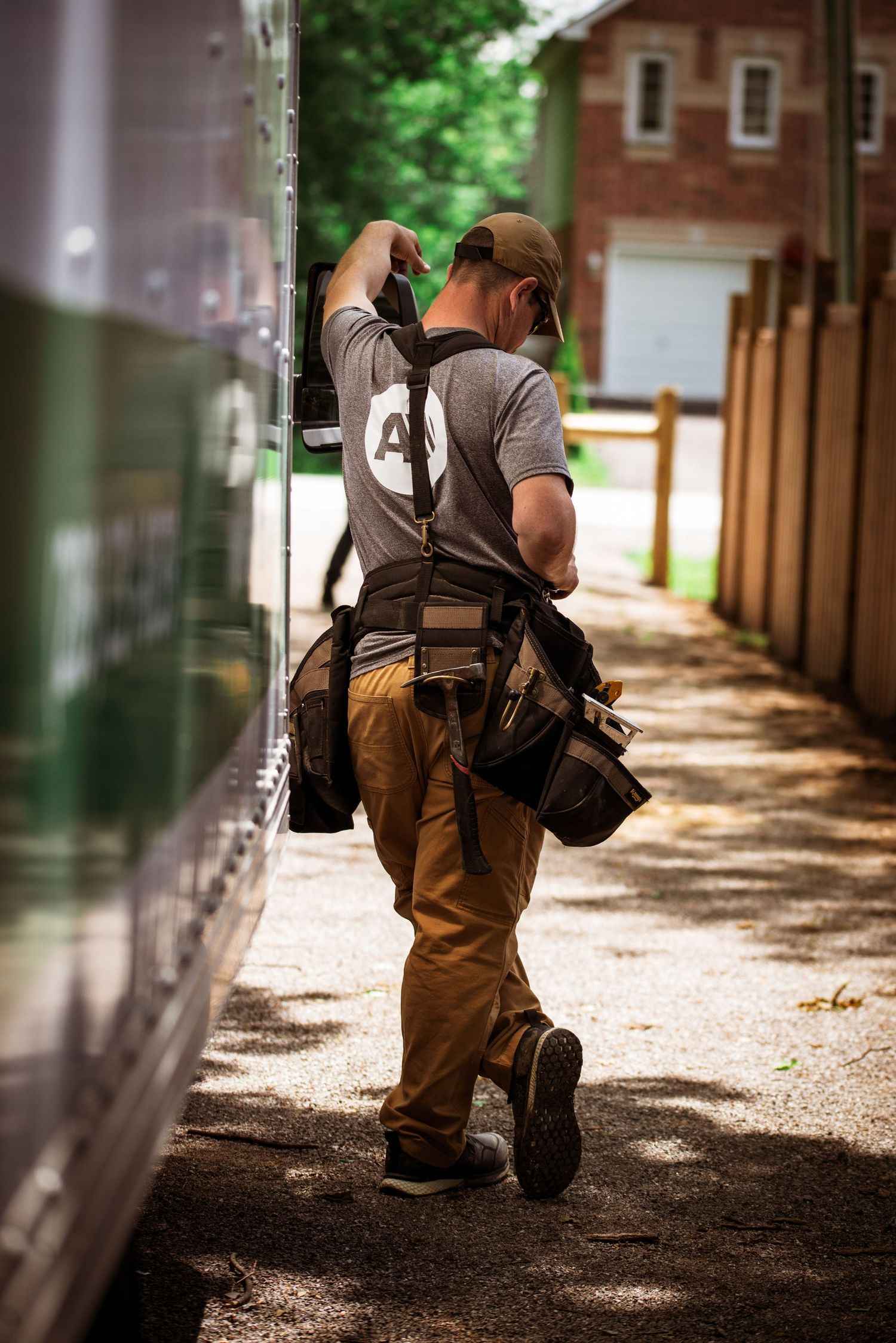 Branding photography in Brock Township, Ontario featuring a business owner taking a break beside a work truck