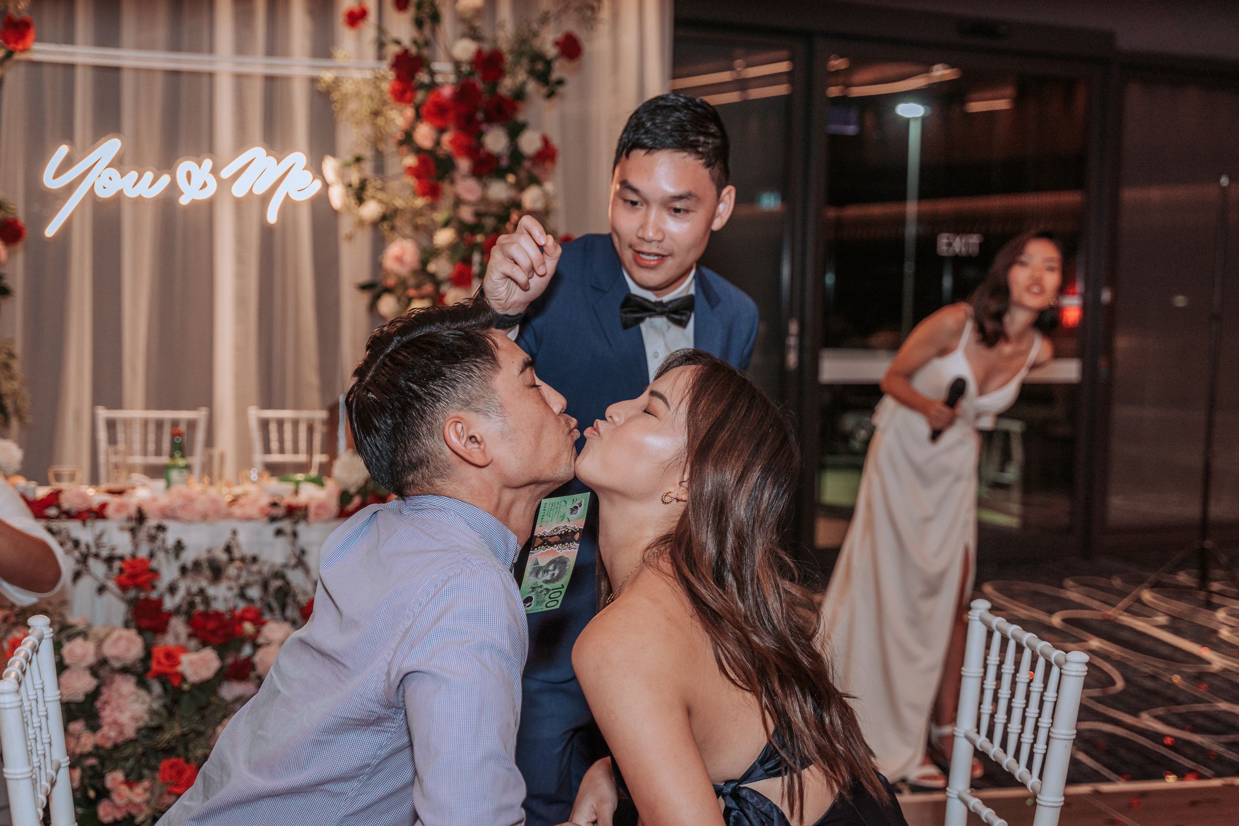 Playful celebration moment captured during a wedding reception party.