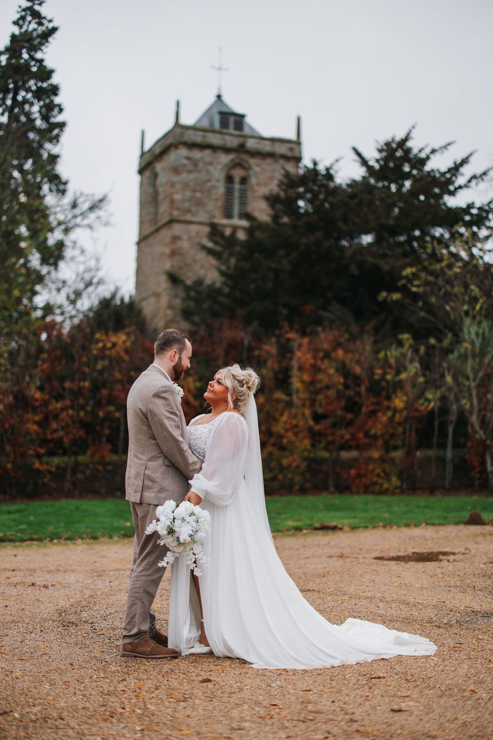 bride and groom in front of church
