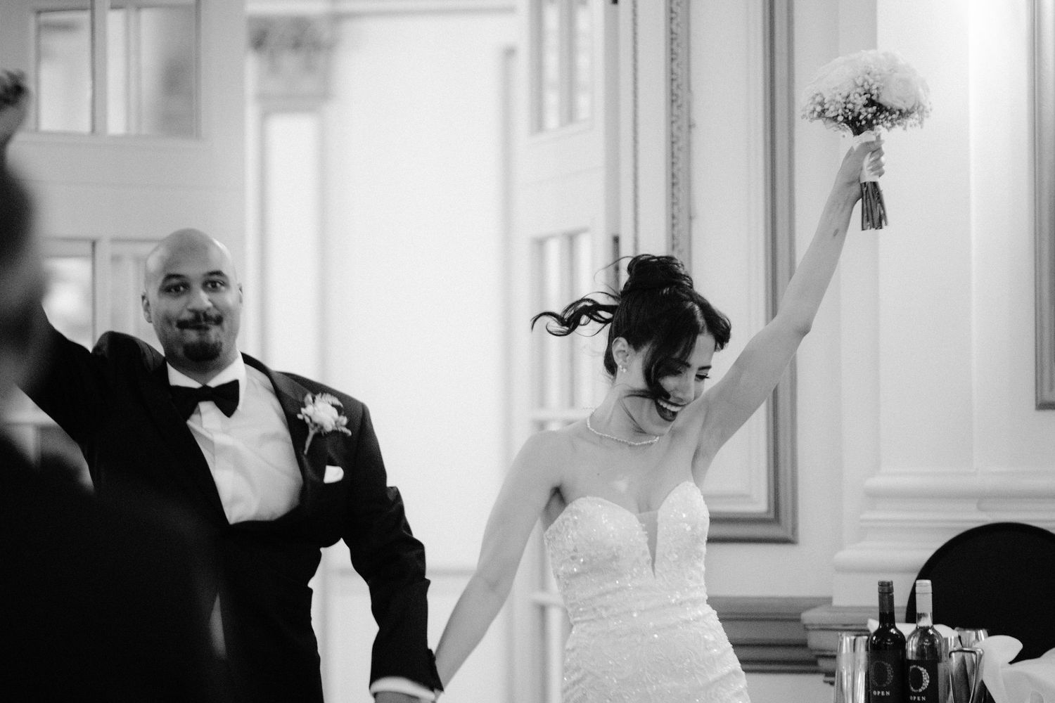 A collection of black and white wedding photos showing intimate moments between couples during their special day.