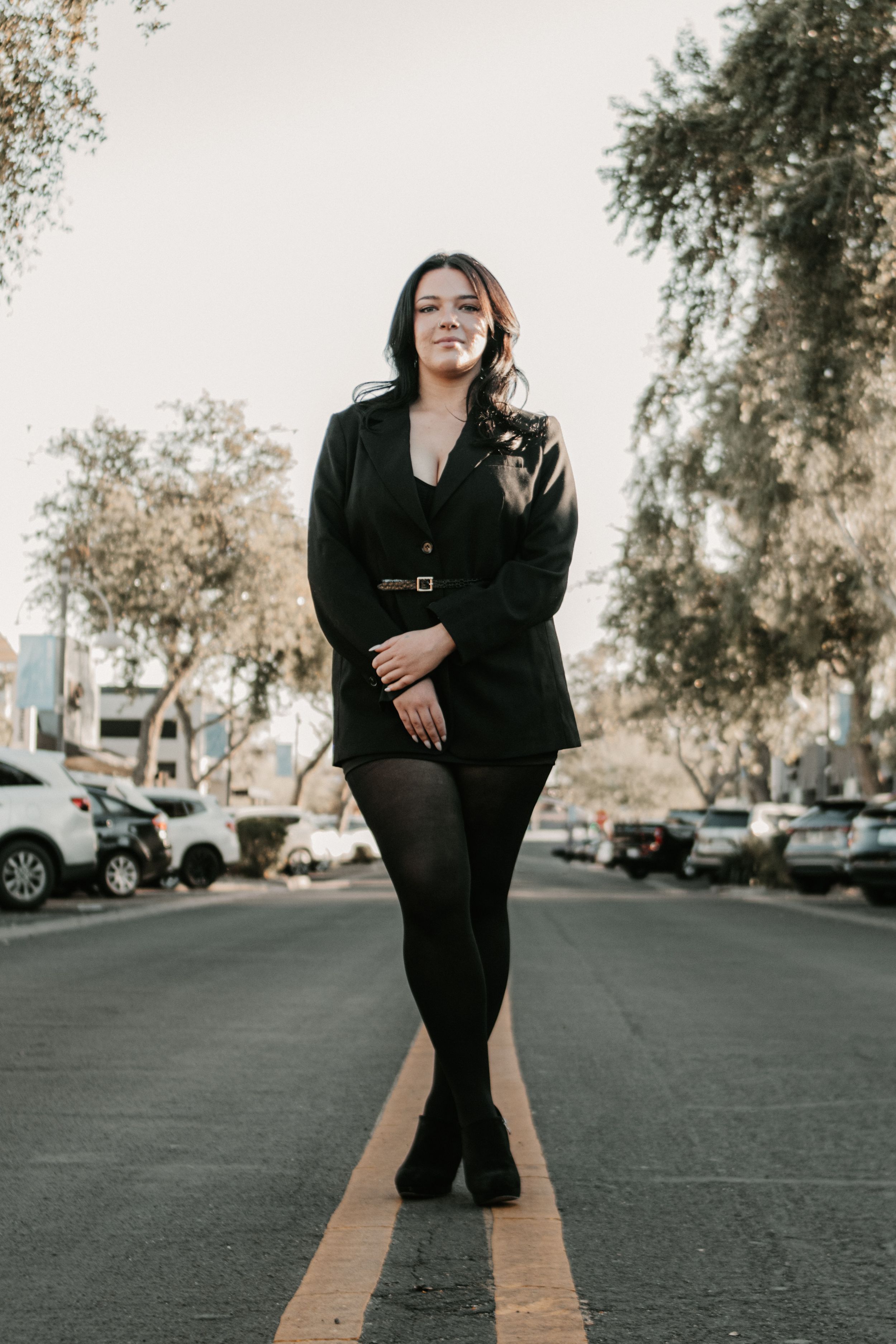 Warm and moody senior portraits captured in the Arizona desert landscape.