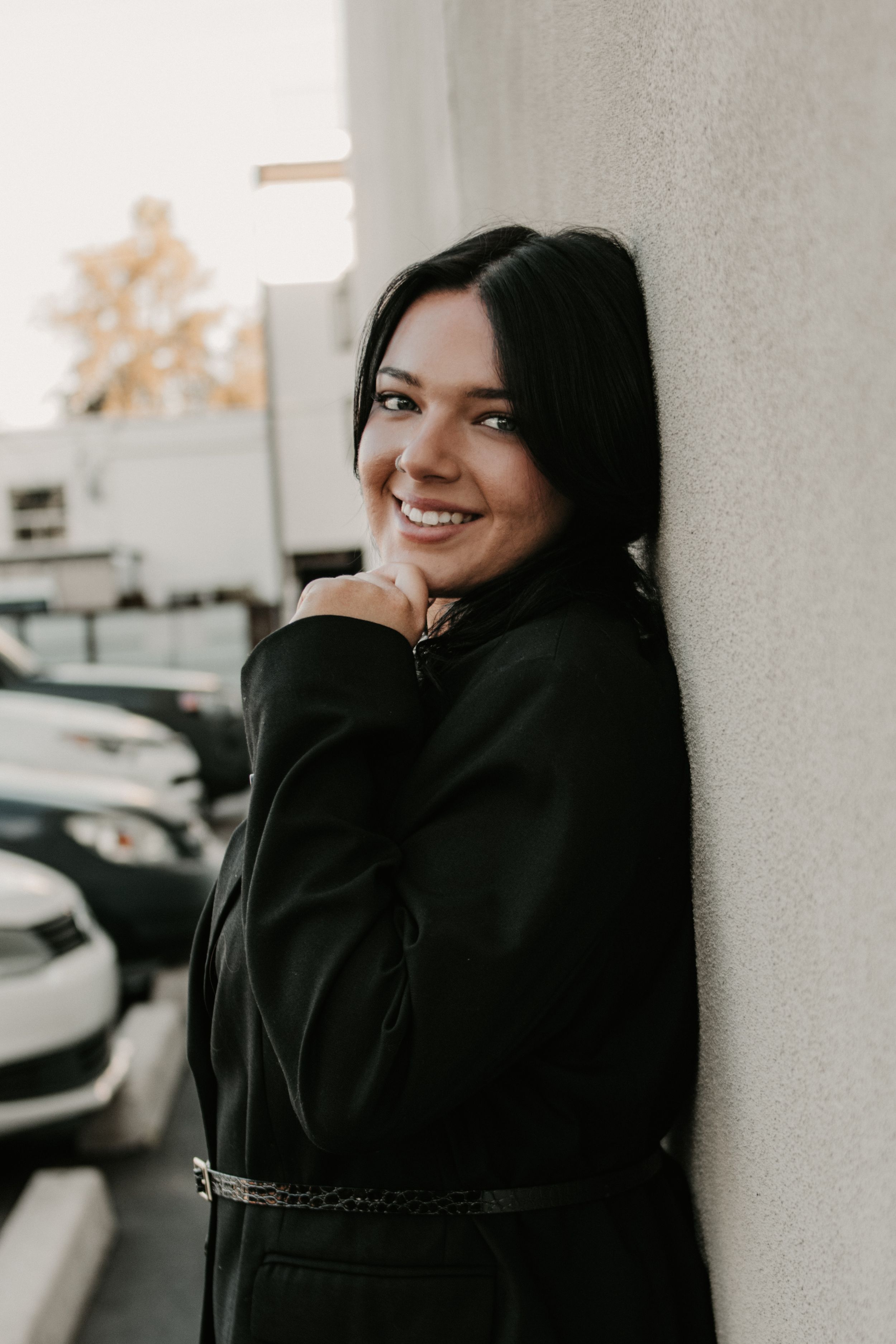 Senior graduate smiling during an outdoor portrait session in Buckeye Arizona.