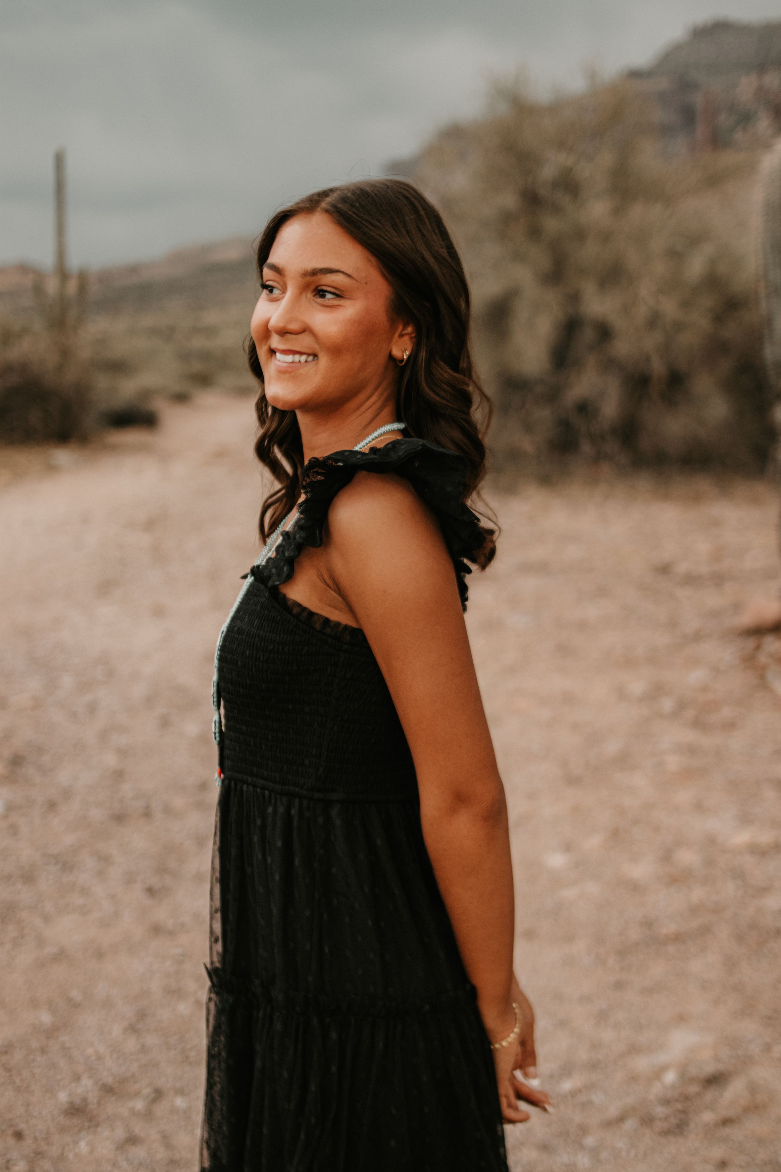 High school graduate photographed outdoors in the Arizona mountains.