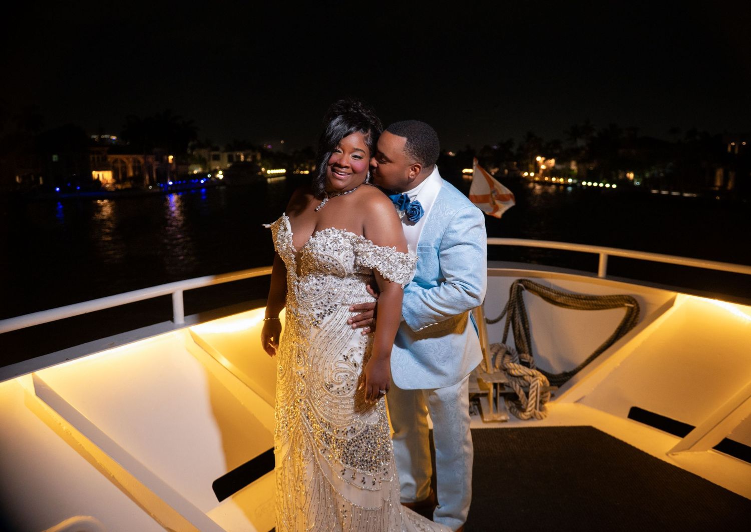South Florida wedding photographers captured this couple on the deck of the Sun Dream Yacht Caprice in Middle River, Fort Lauderdale, FL