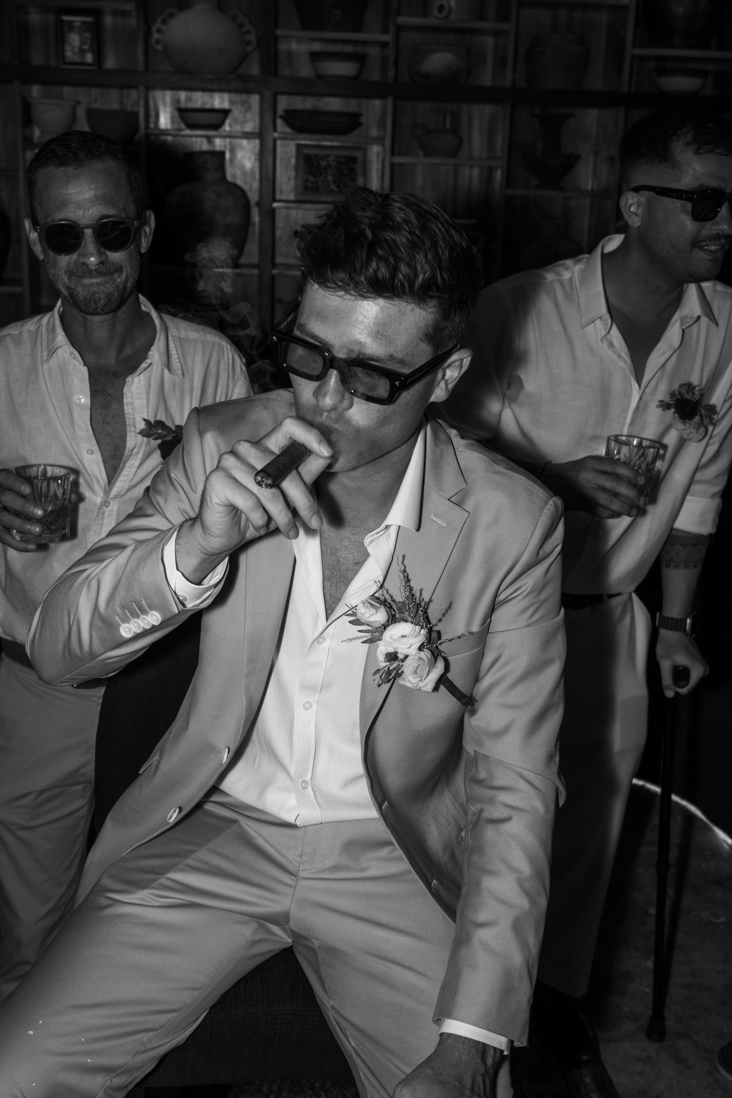 Black and white image series showing a person in white clothing drinking something in multiple sequential frames.