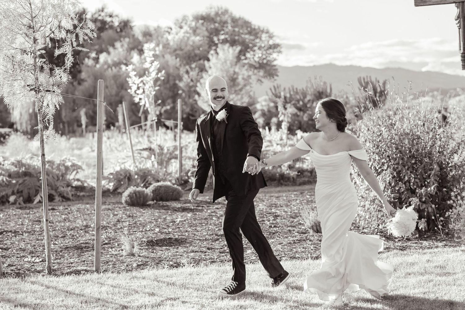 A romantic sequence of wedding photos shows a couple walking and posing together in an outdoor garden setting.