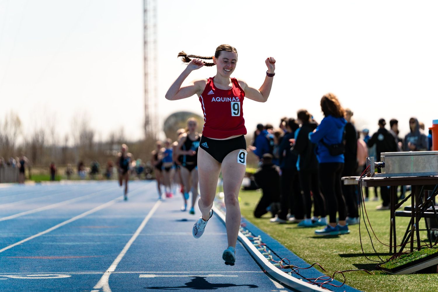 Madison Rempalski celebrating a top 5k finish, Al Owens Classic, GVSU Track and Lacrosse Field, Allendale MI, 4/11/26