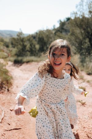 Children smiling while finding cool plants in Paulo Duro Canyon in Canyon texas.