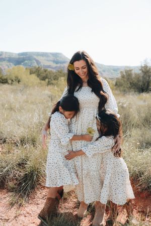 Mother and daughter pose in Paulo Duro Canyon in Canyon, Texas. Cowboy style, western outfit.