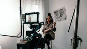 A series of film stills showing people engaging in street photography and camera work in an urban setting.