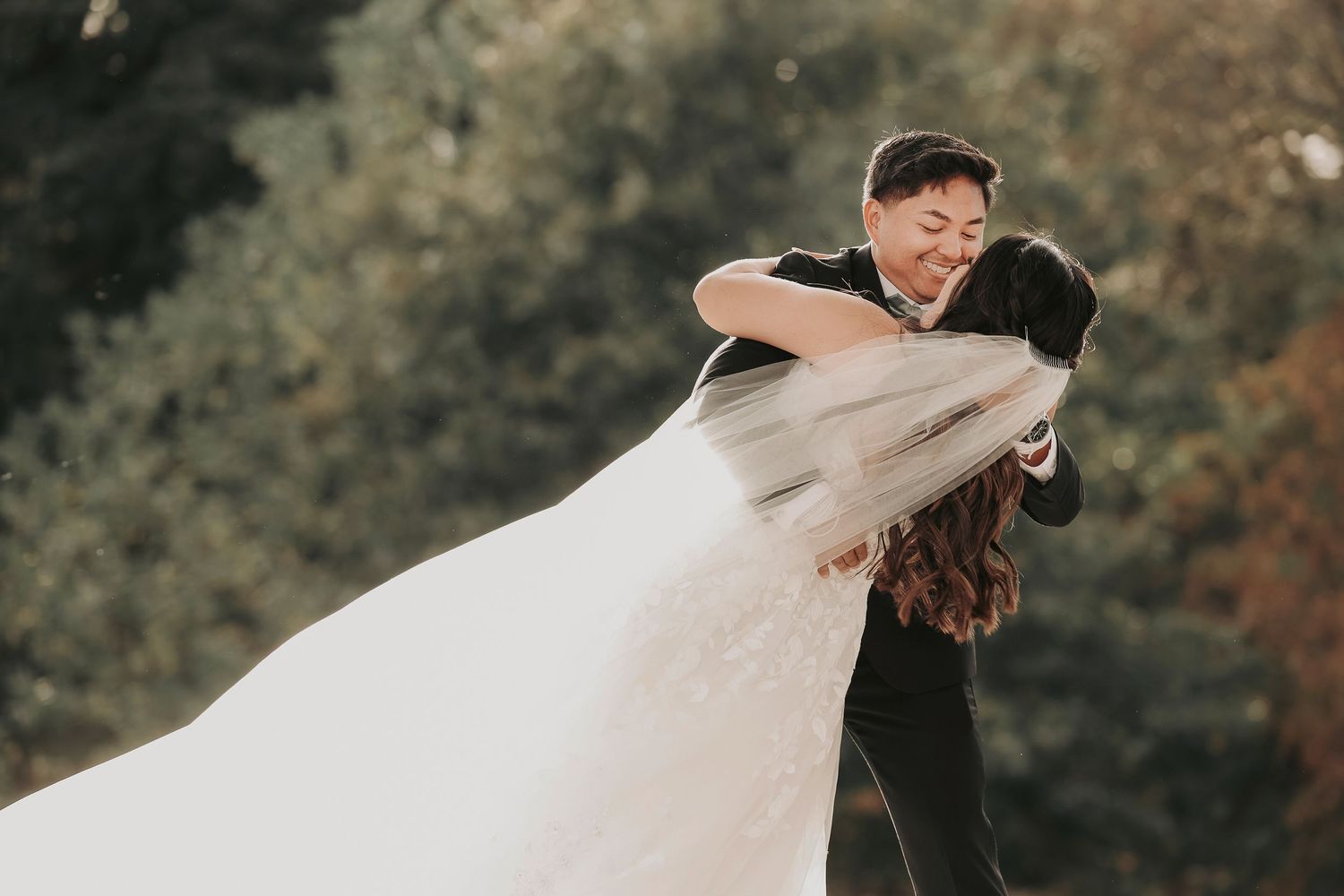 the groom dips his bride for their first kiss