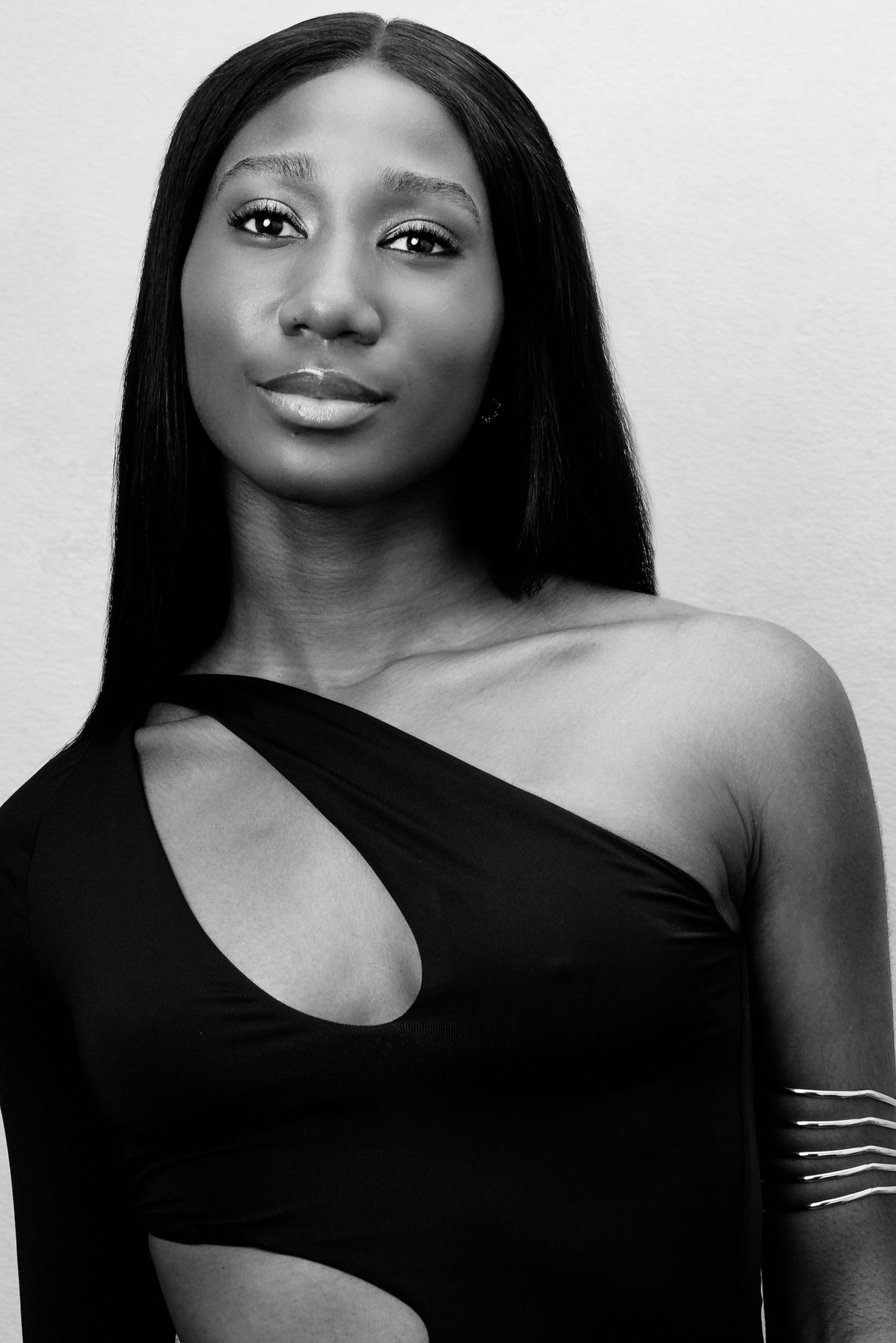 Black and white portrait series showing elegant poses and expressions against a light background.