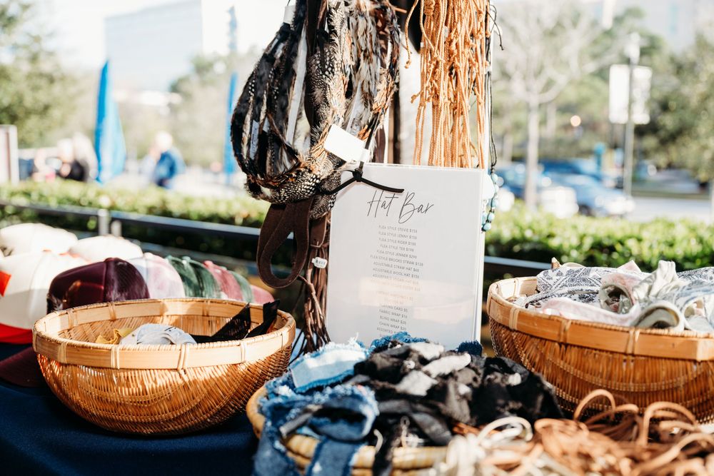 Rustic wooden baskets and decorative elements arranged at an outdoor event setup.