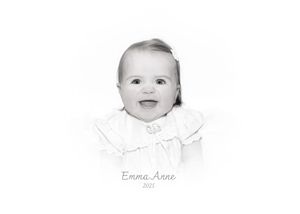 A series of four black and white baby portraits showing different expressions and poses.