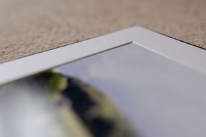 Blurred close-up photo of text on white paper gradually coming into focus across multiple frames.