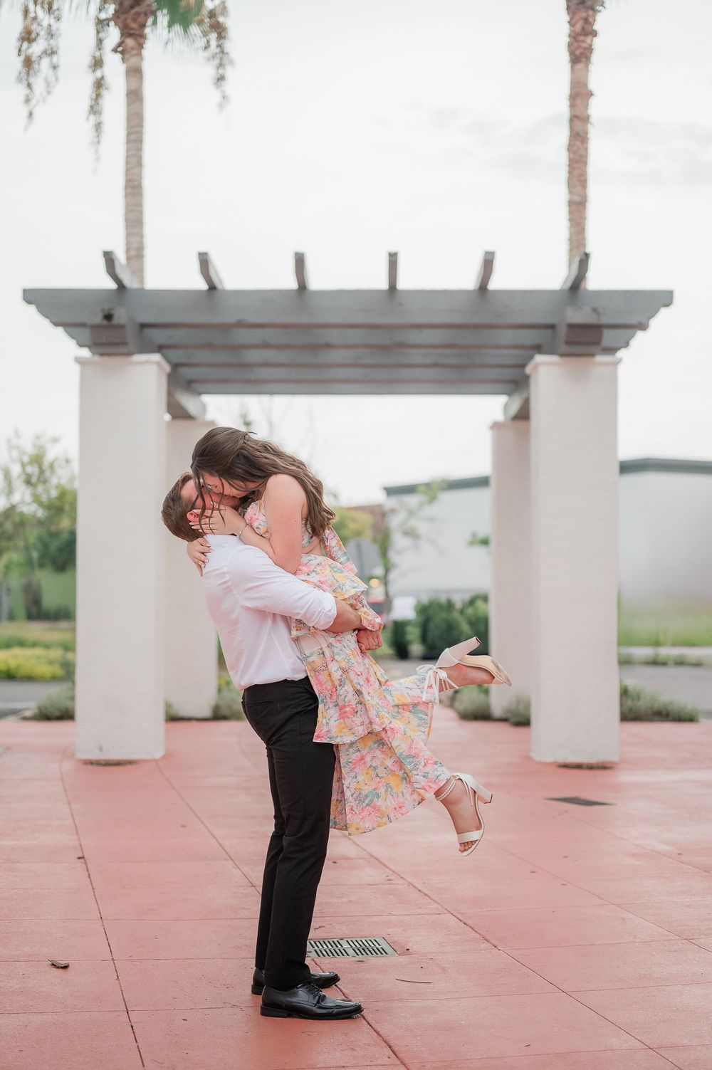 Series of romantic dance dip poses captured under an outdoor pergola with palm trees.