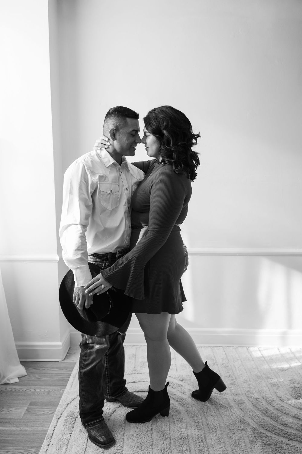 Series of black and white romantic photos showing a couple dancing together in an intimate moment.