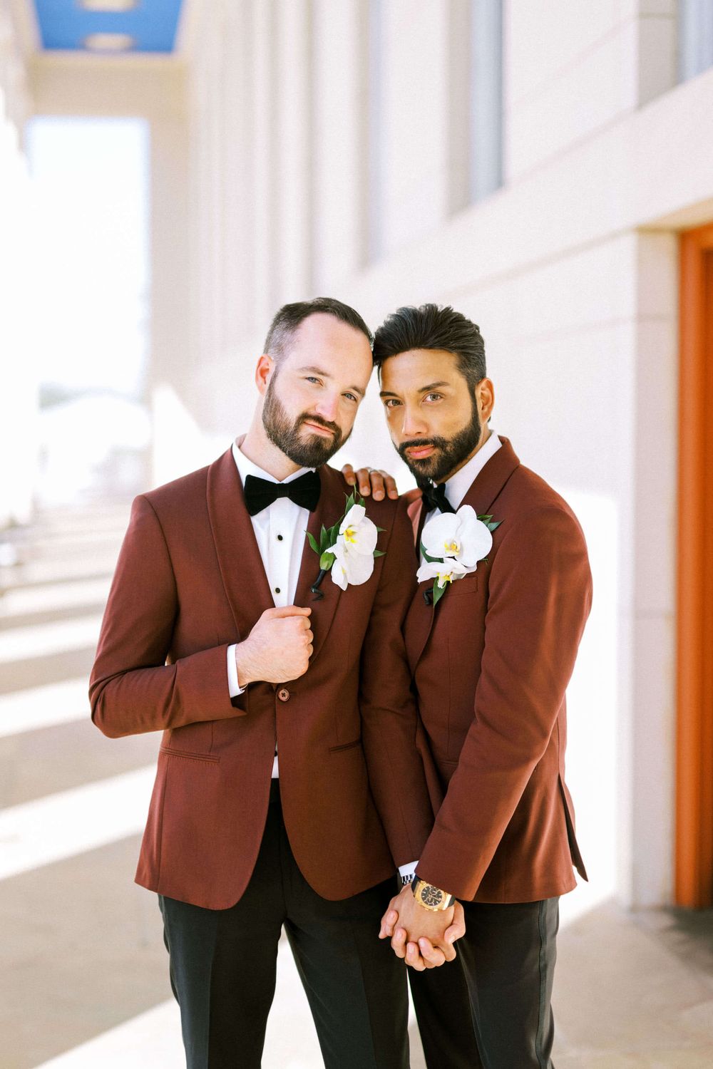 Two grooms pose in an editorial style after their big, gay Dallas wedding.